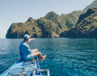 mobile-man-on-boat